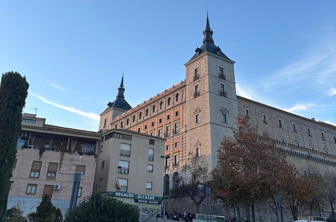 The long south façade of the Alcázar of Toledo above the rooftops