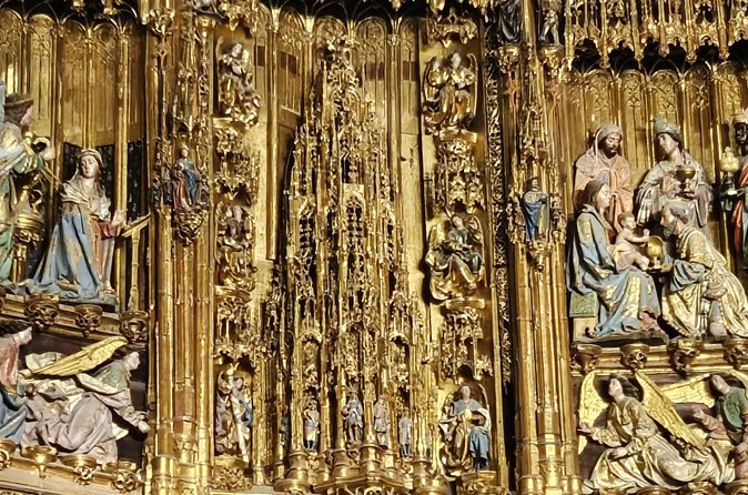 A gilded Gothic altarpiece in Toledo Cathedral, carved in tiers of painted figures
