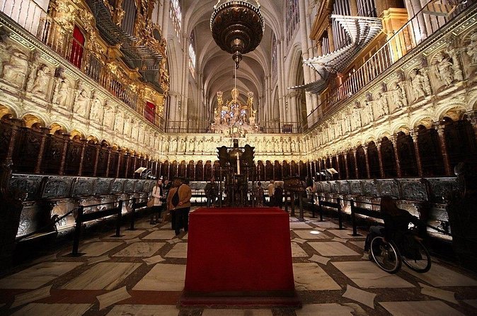 The choir stalls and high altar inside Toledo Cathedral, seen along the nave