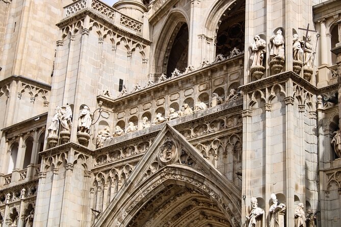 Statues and pinnacles across the Gothic façade of Toledo Cathedral