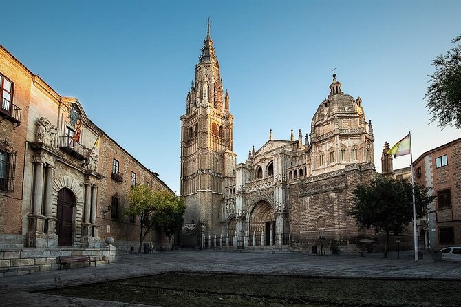 Toledo Cathedral's bell tower and dome seen across the open square in front of it