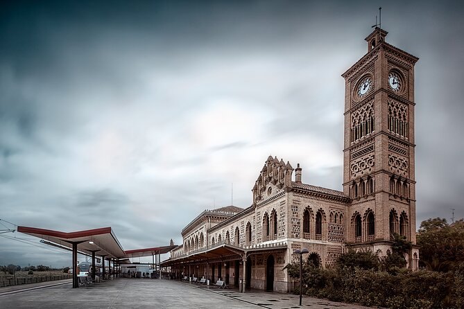 Toledo's neo-Mudéjar railway station with its brick clock tower and open canopy