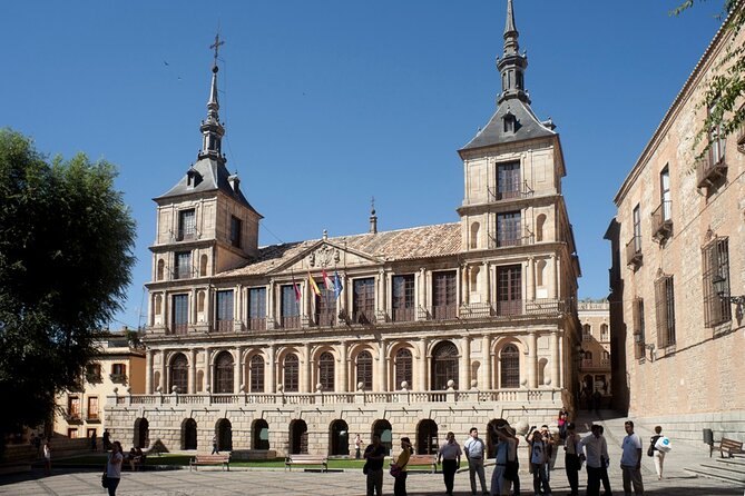 Toledo's town hall on Plaza del Consistorio with the Cathedral tower rising behind it
